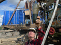 PetroNeft VP, Karl Johnson, checks oil quality